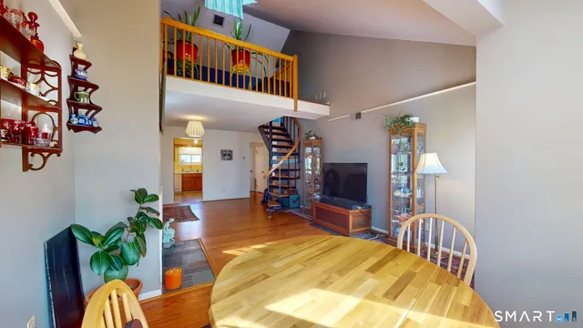 a view of a bedroom with furniture and workspace