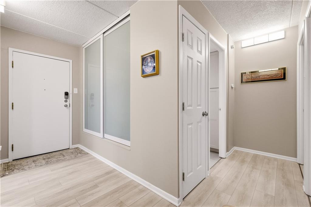 5600 Munhall Road, Unit 501 Pittsburgh, PA 15217 - Photo 6 of 37 Entry door to Unit 501 with frosted coat closet doors.
