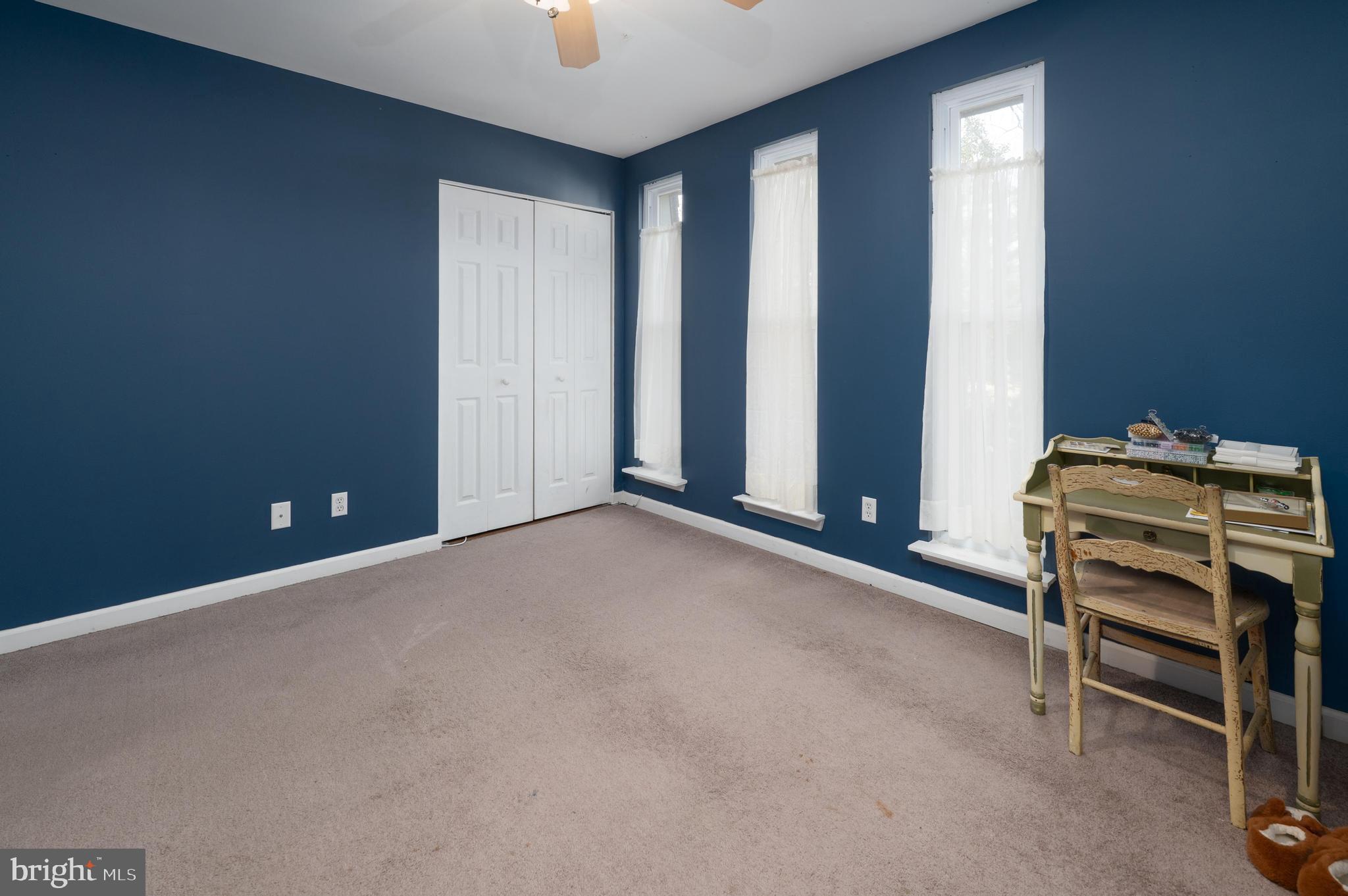25 South Church Road, Unit 64 Maple Shade, NJ 08052 - Photo 16 of 21 an empty room with a empty space and windows
