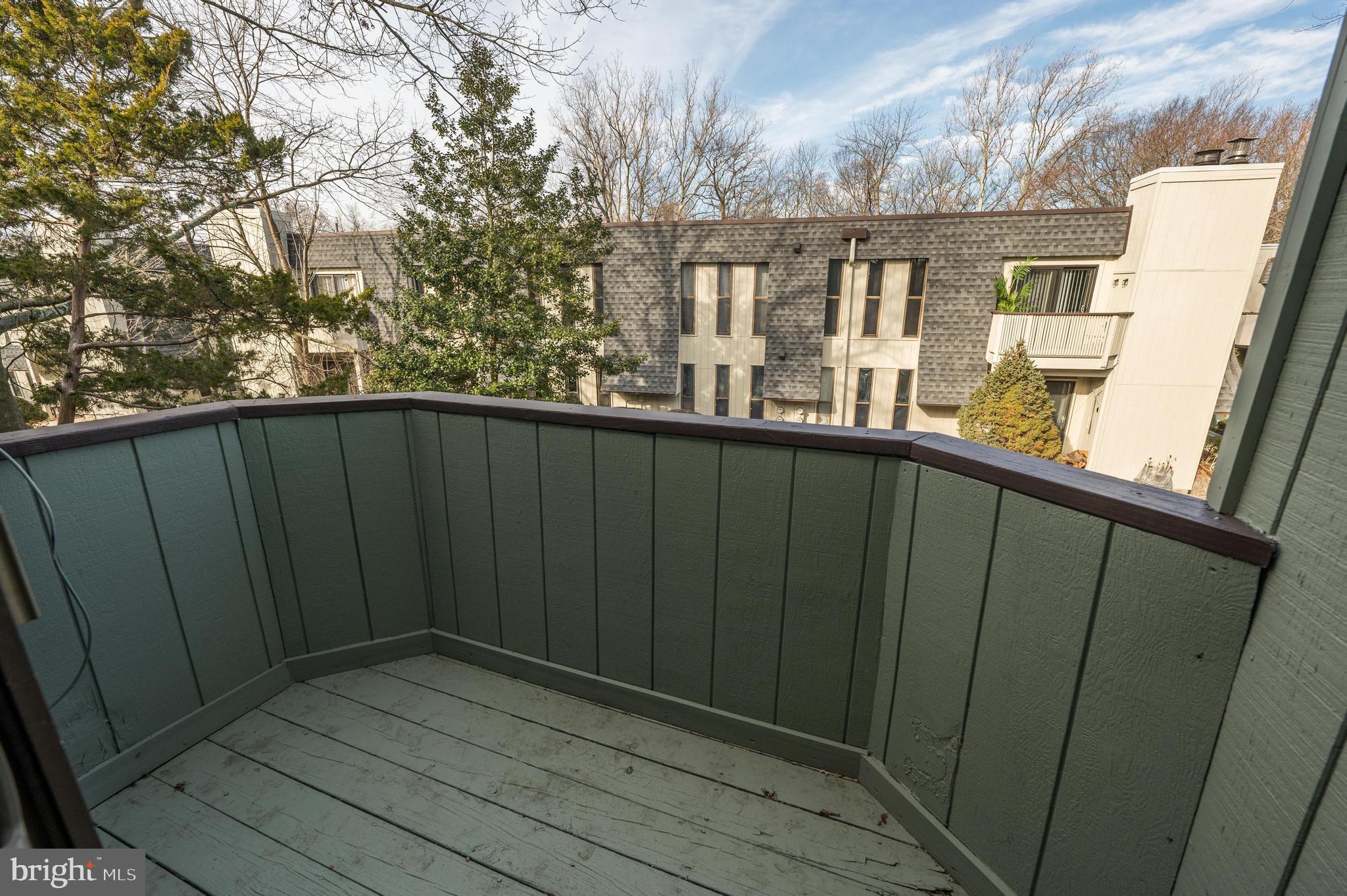 25 South Church Road, Unit 64 Maple Shade, NJ 08052 - Photo 3 of 21 a view of balcony with wooden floor and fence