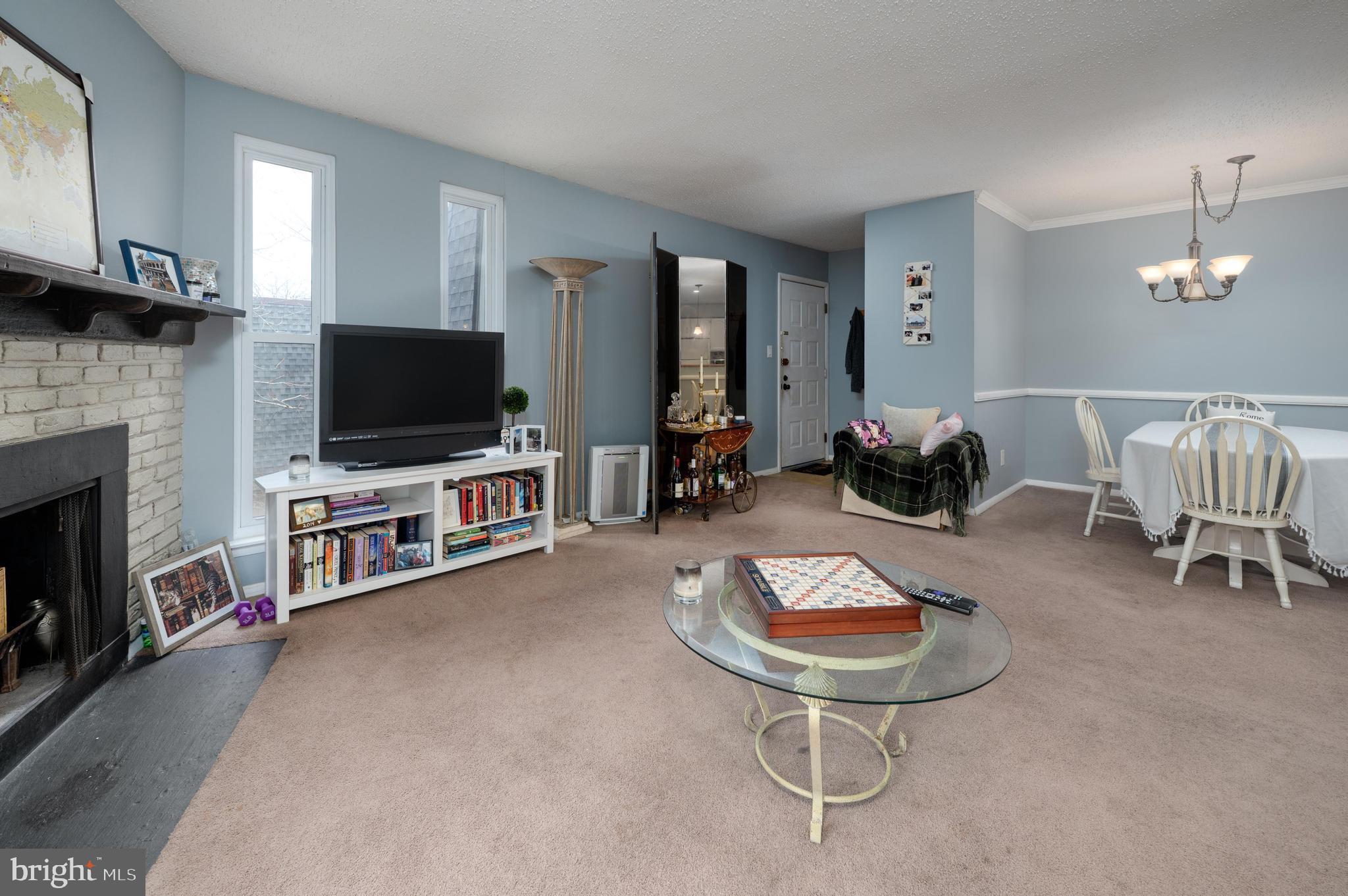 25 South Church Road, Unit 64 Maple Shade, NJ 08052 - Photo 5 of 21 a living room with furniture and a flat screen tv