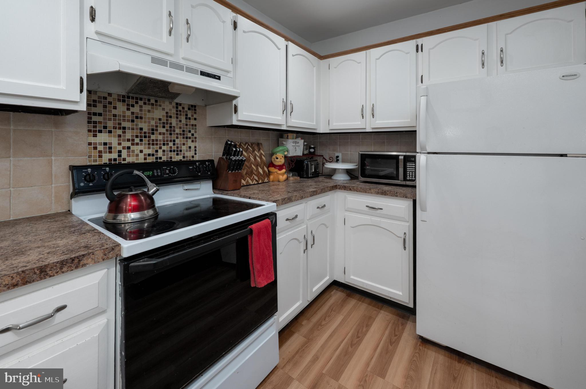 25 South Church Road, Unit 64 Maple Shade, NJ 08052 - Photo 9 of 21 a kitchen with stainless steel appliances granite countertop a stove and a refrigerator