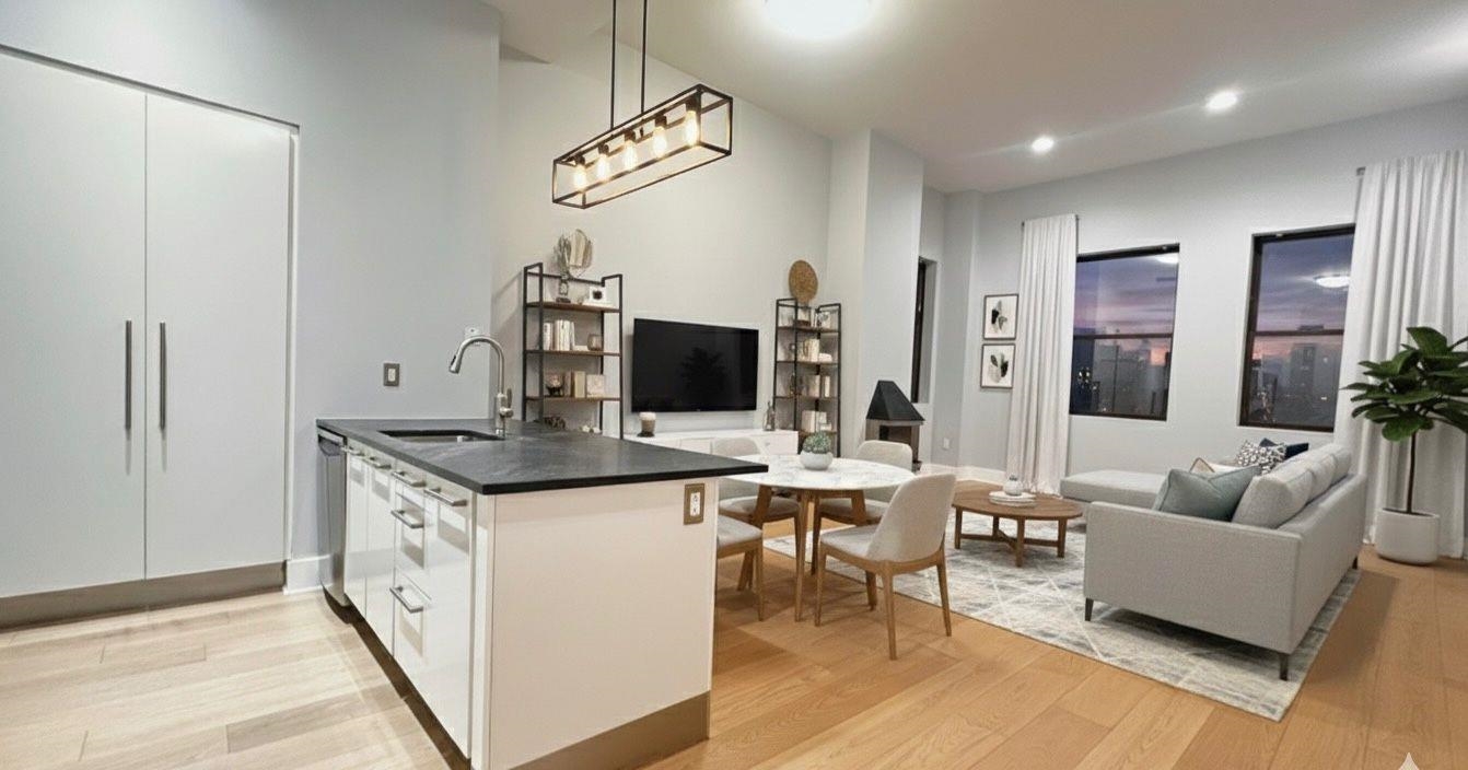 4 Beacon Way, Unit 301 Jersey City, NJ 07304 - Photo 1 of 26 a living room with granite countertop furniture a rug and a flat screen tv