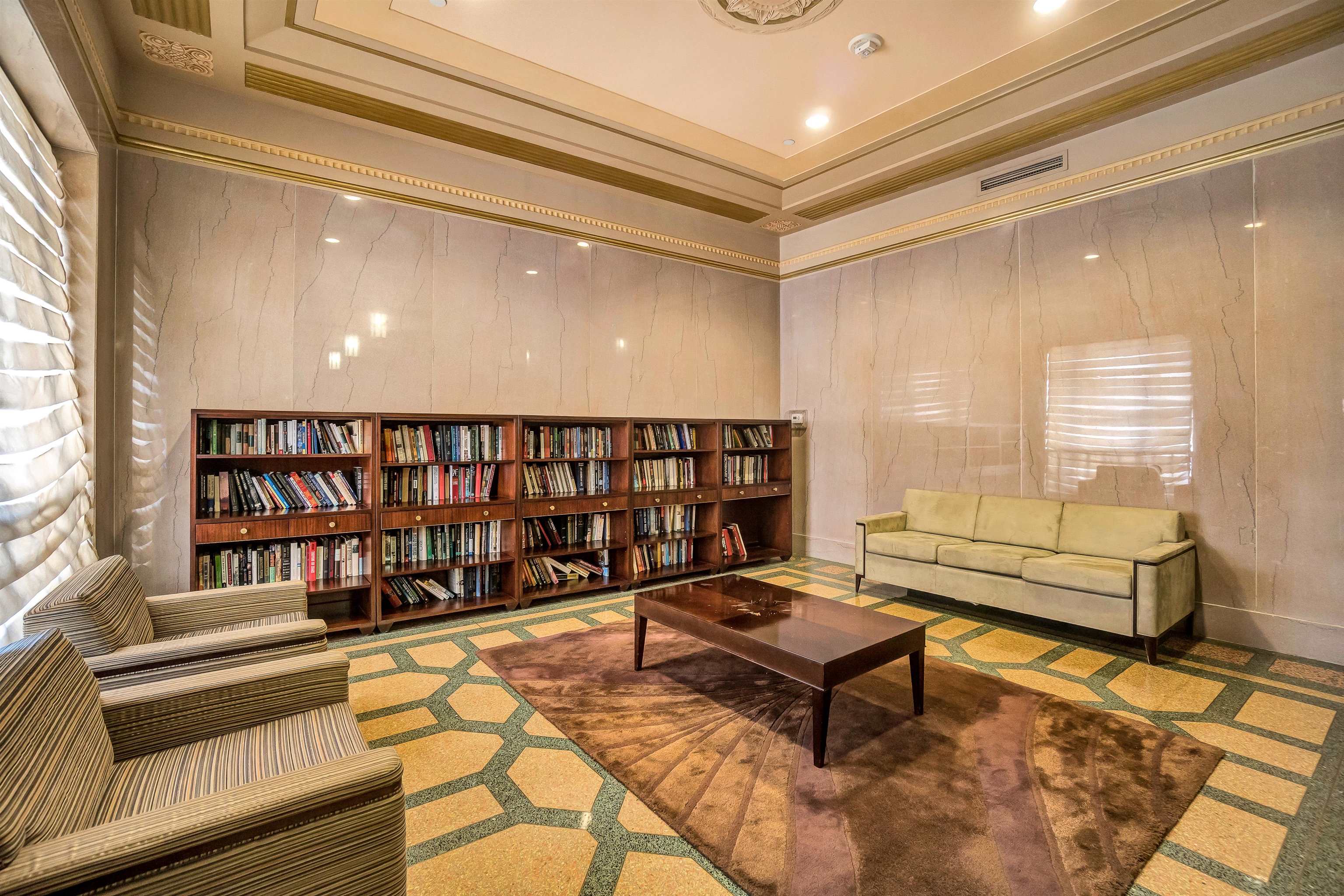 4 Beacon Way, Unit 301 Jersey City, NJ 07304 - Photo 23 of 26 a reading room with furniture and a book shelf