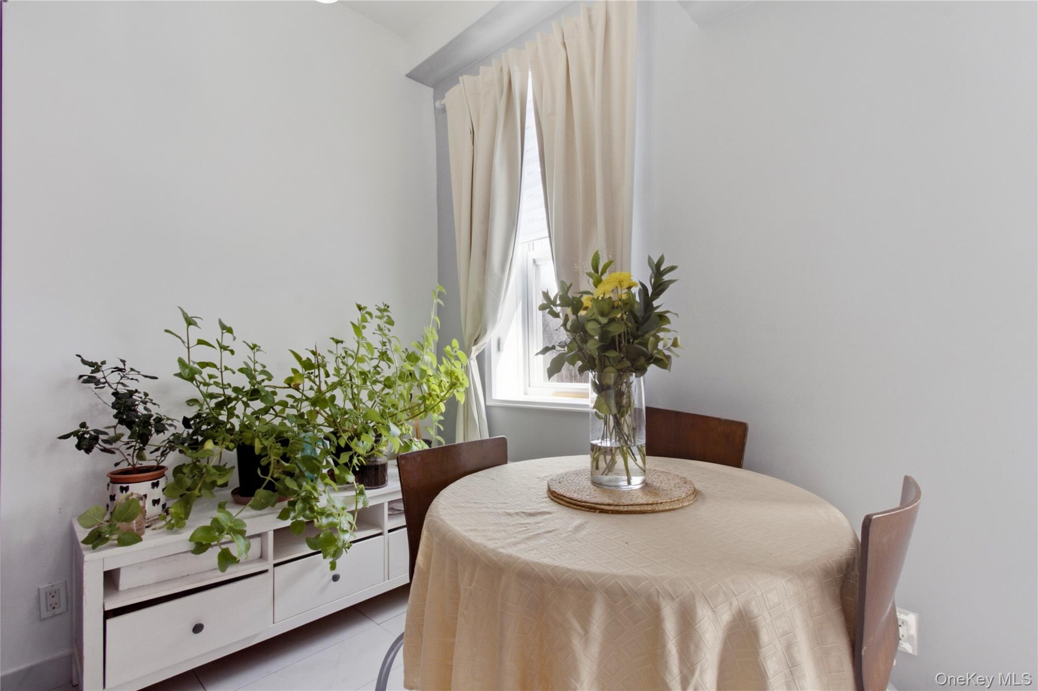 245 Rumsey Road, Unit 2S Yonkers, NY 10701 - Photo 10 of 21 a vase of flowers sitting on a table