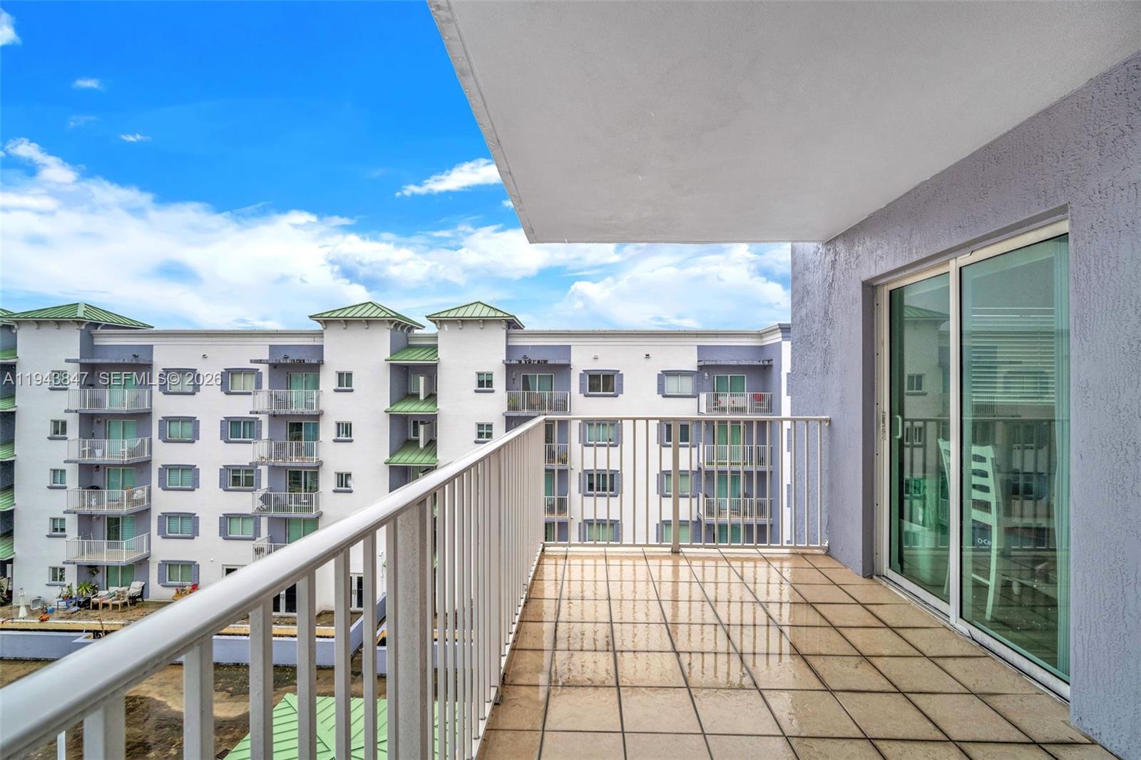 2475 Northwest 16th St Road, Unit 601 Miami, FL 33125 - Photo 20 of 26 a view of staircase with white walls and windows