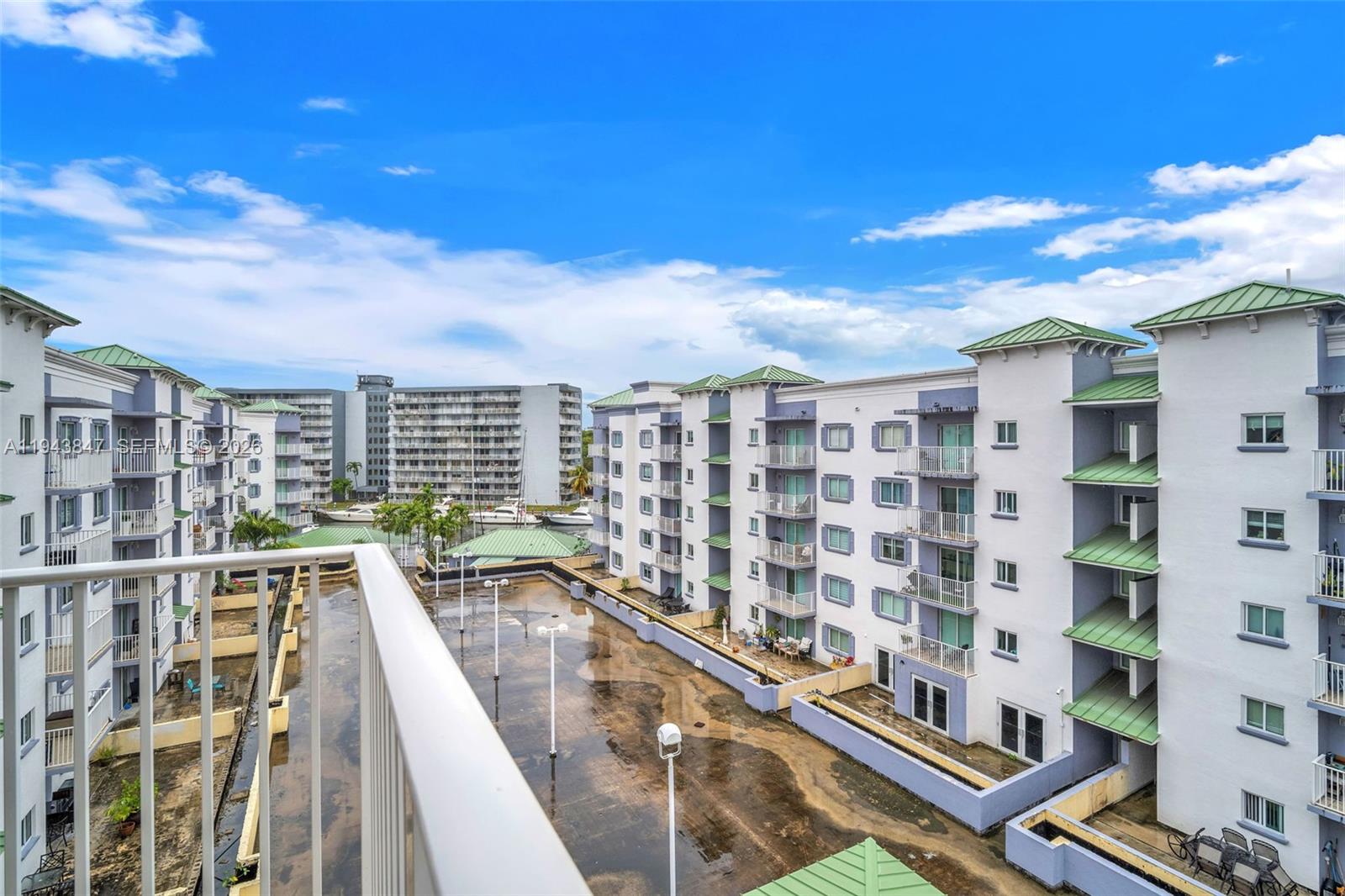 2475 Northwest 16th St Road, Unit 601 Miami, FL 33125 - Photo 21 of 26 a view of a balcony with city view
