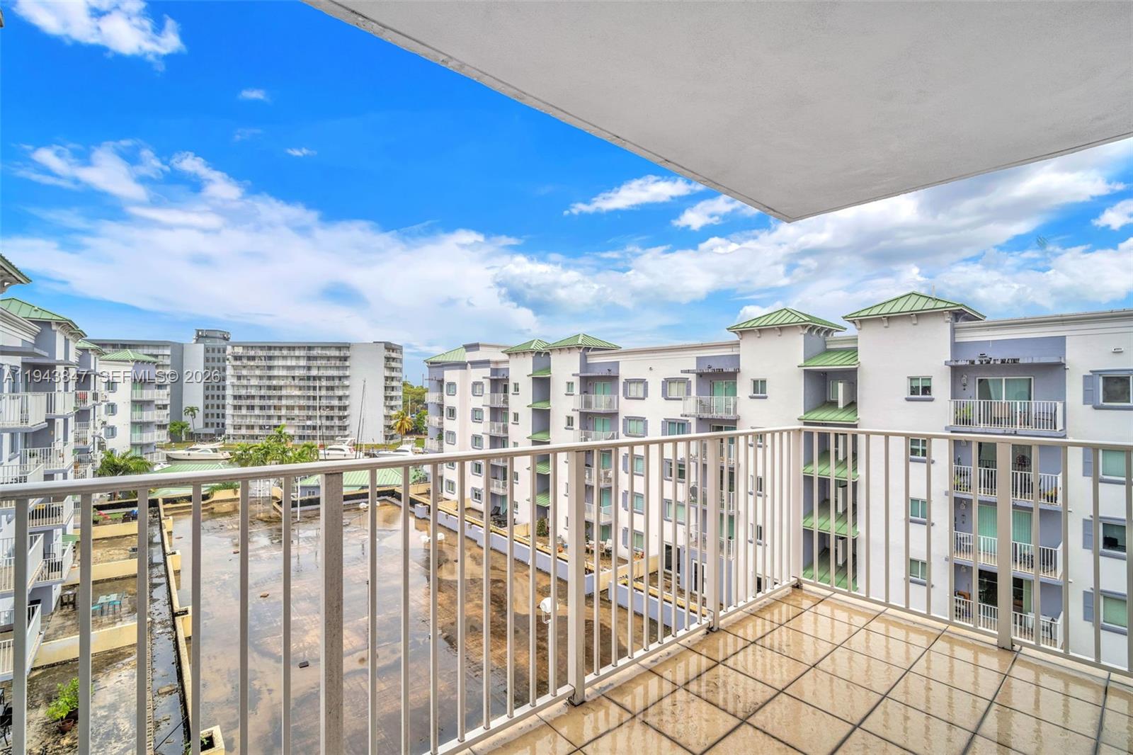 2475 Northwest 16th St Road, Unit 601 Miami, FL 33125 - Photo 22 of 26 a view of a building from a balcony