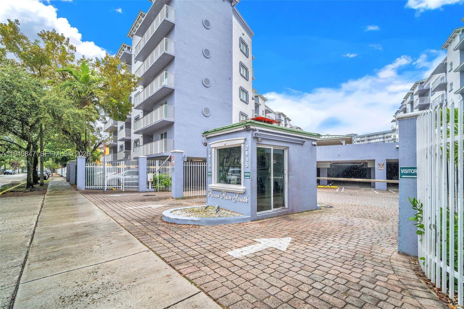 2475 Northwest 16th St Road, Unit 601 Miami, FL 33125 - Photo 25 of 26 a front view of a building with a porch