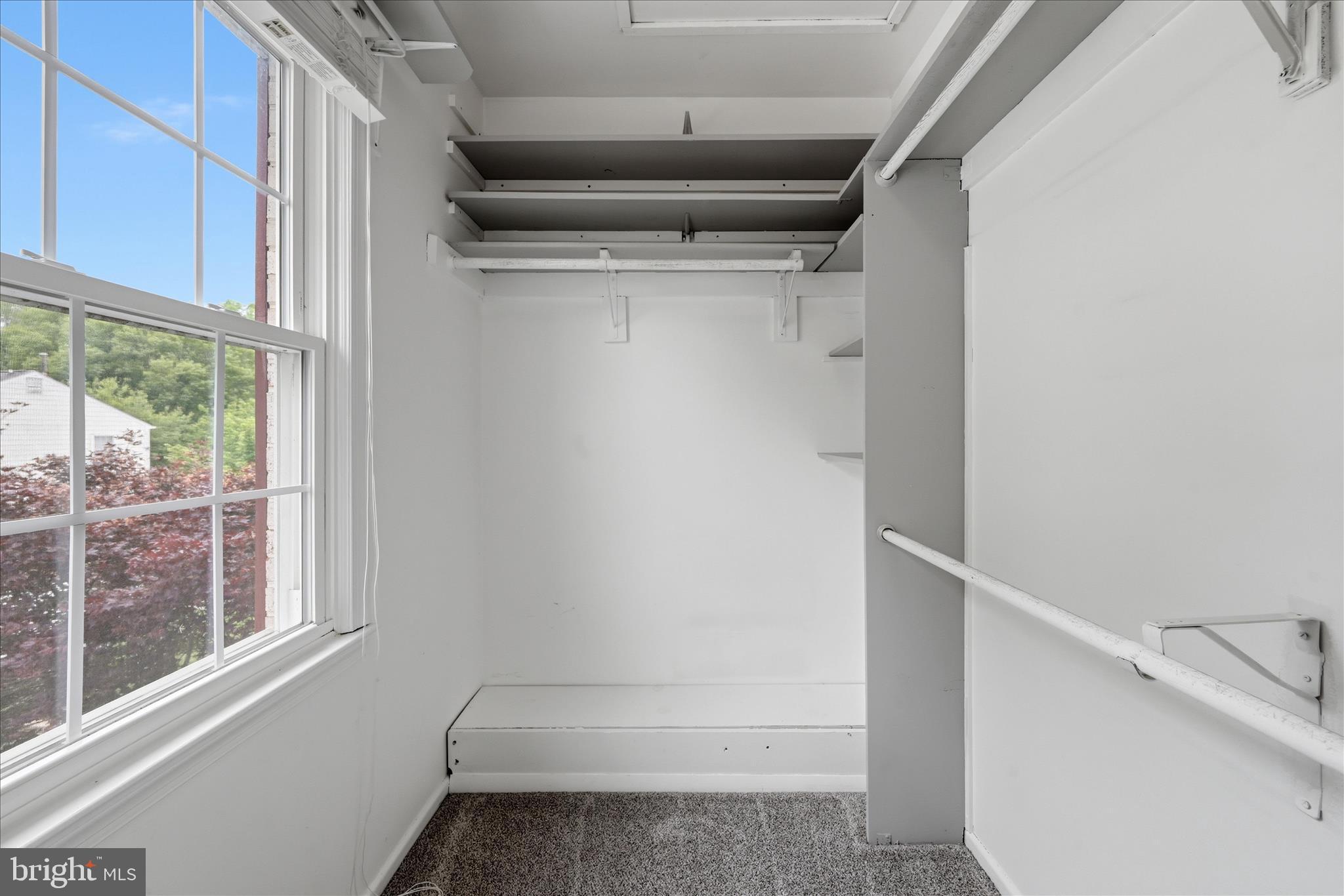 5446 Lighthouse Lane Burke, VA 22015 - Photo 15 of 36 a view of walk in closet with empty racks