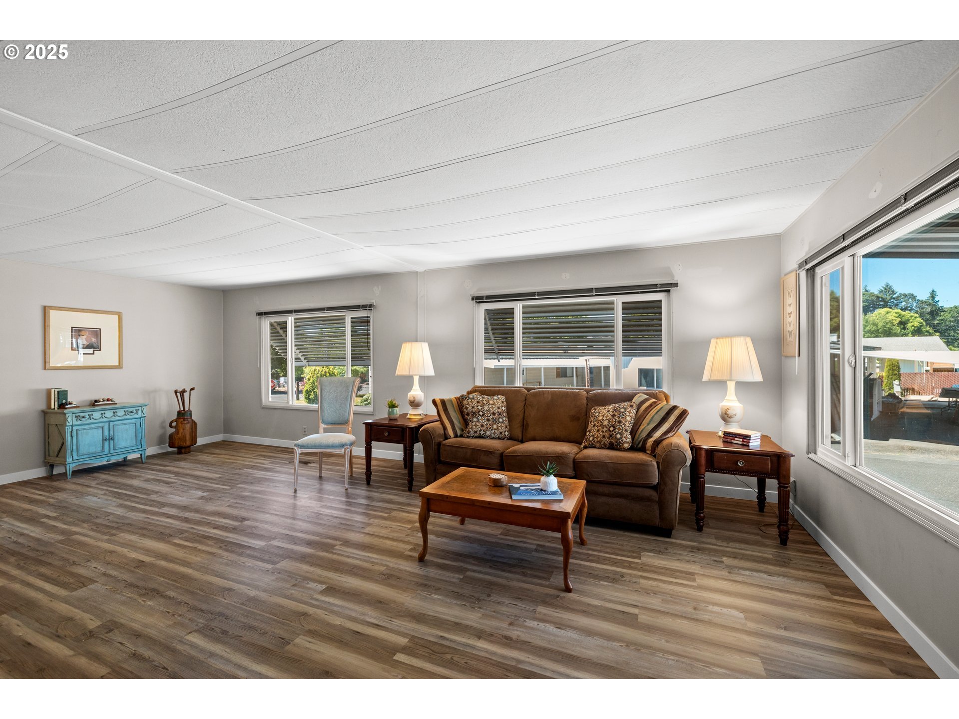 3405 Southeast Vineyard Road, Unit 49 Milwaukie, OR 97267 - Photo 14 of 43 a living room with furniture and a wooden floor