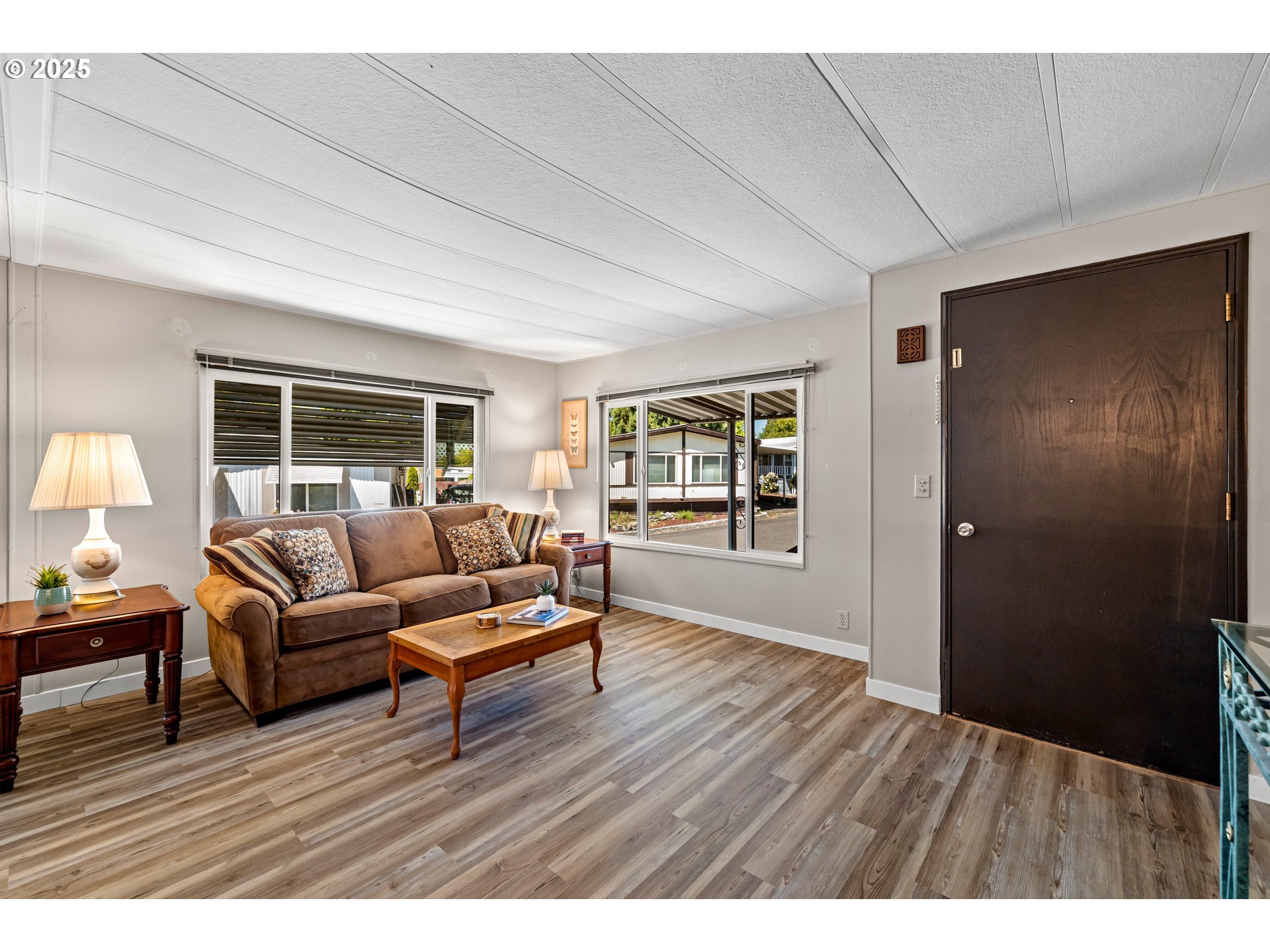 3405 Southeast Vineyard Road, Unit 49 Milwaukie, OR 97267 - Photo 17 of 43 a living room with furniture and a wooden floor