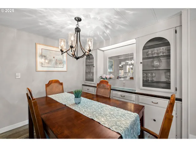 a view of a dining room and hall with furniture