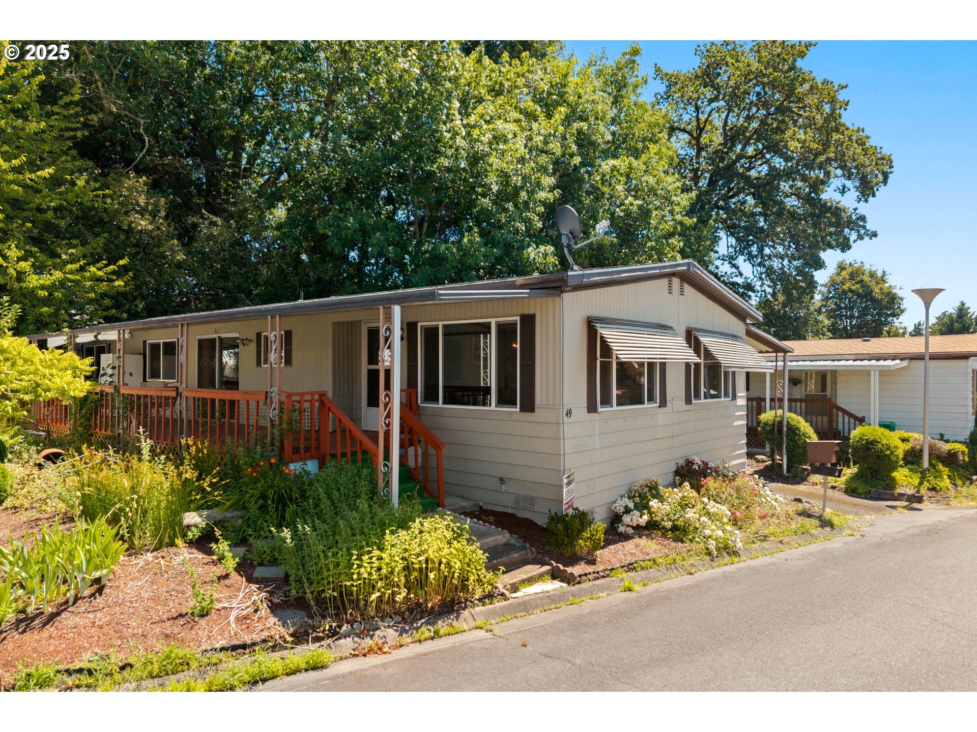 3405 Southeast Vineyard Road, Unit 49 Milwaukie, OR 97267 - Photo 2 of 43 a view of a house with wooden fence