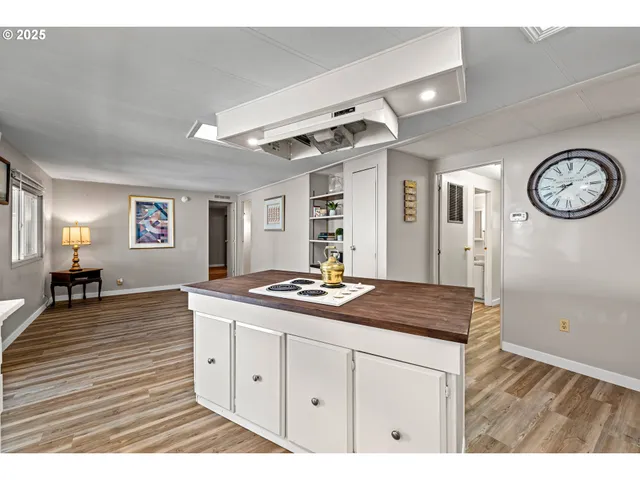 a bathroom with a sink a vanity and a mirror