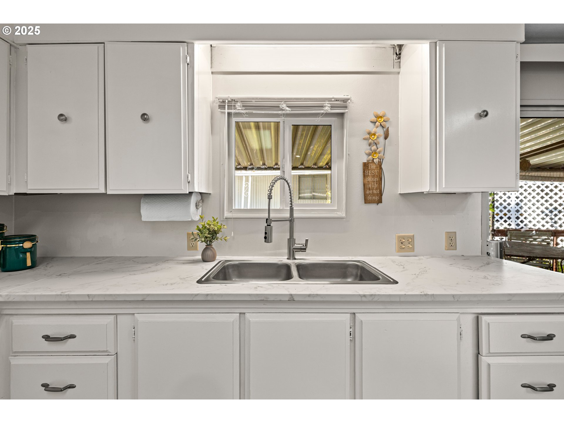 3405 Southeast Vineyard Road, Unit 49 Milwaukie, OR 97267 - Photo 25 of 43 a kitchen with stainless steel appliances white cabinets and a sink