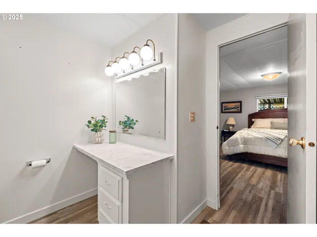 a view of livingroom with kitchen island furniture and wooden floor