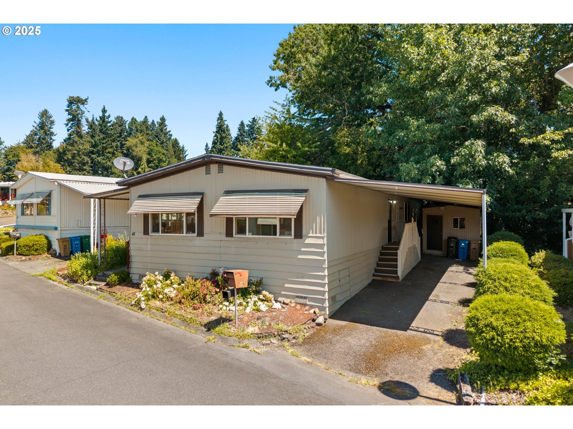 3405 Southeast Vineyard Road, Unit 49 Milwaukie, OR 97267 - Photo 4 of 43 a view of a house with a yard