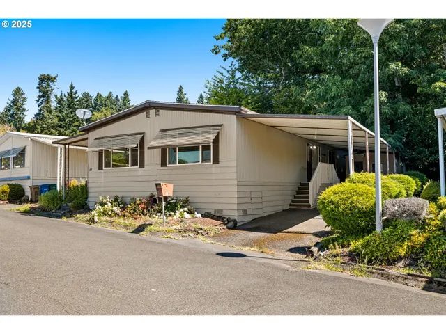 a view of a backyard with sitting area and entertaining space
