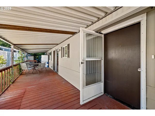 a view of living room and wooden floor