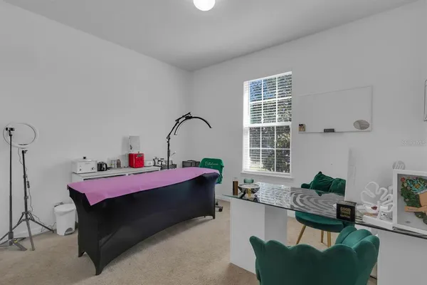 a view of a hallway with wooden floor and windows