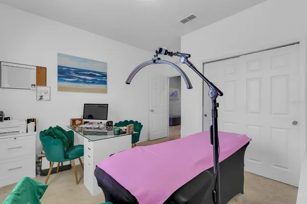 a bedroom with furniture and a chandelier