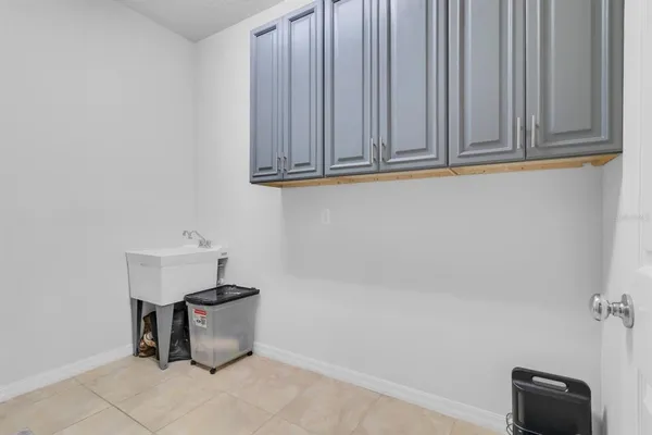 an aerial view of residential houses with outdoor space and lake view