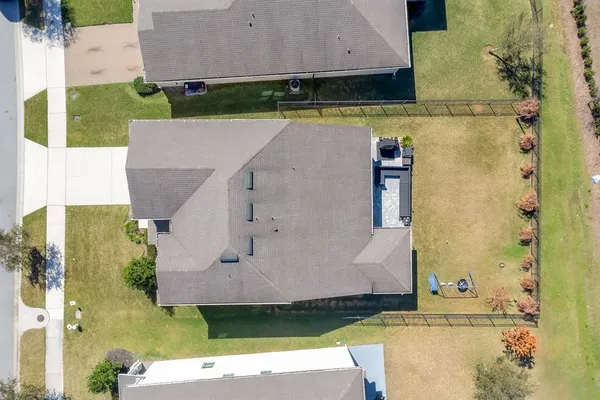 an aerial view of a house with a garden