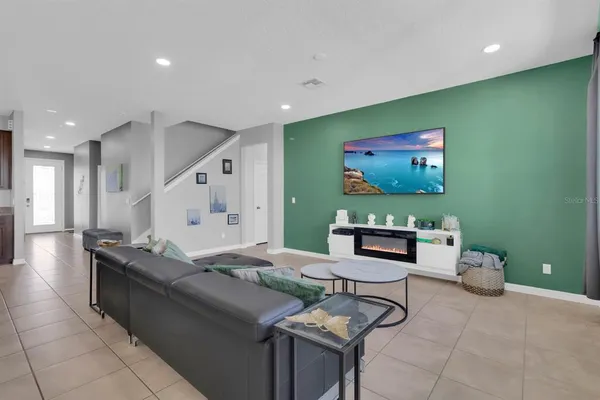 a hallway with a view of living room