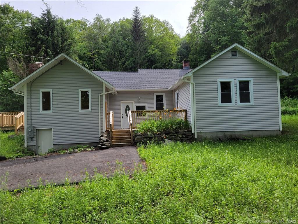 148 Weekeepeemee Road Bethlehem, CT 06751 - Photo 1 of 1 a view of a backyard with plants and a small yard