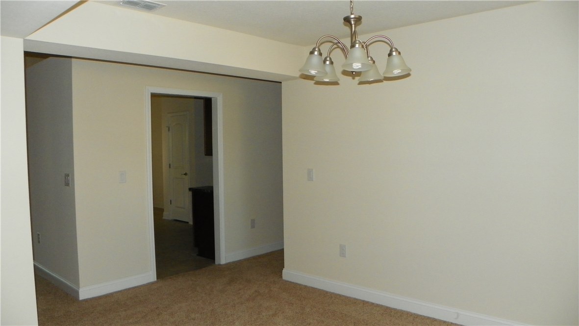 88100 Maybourne Road Yulee, FL 32097 - Photo 4 of 8 a view of a hallway with a door