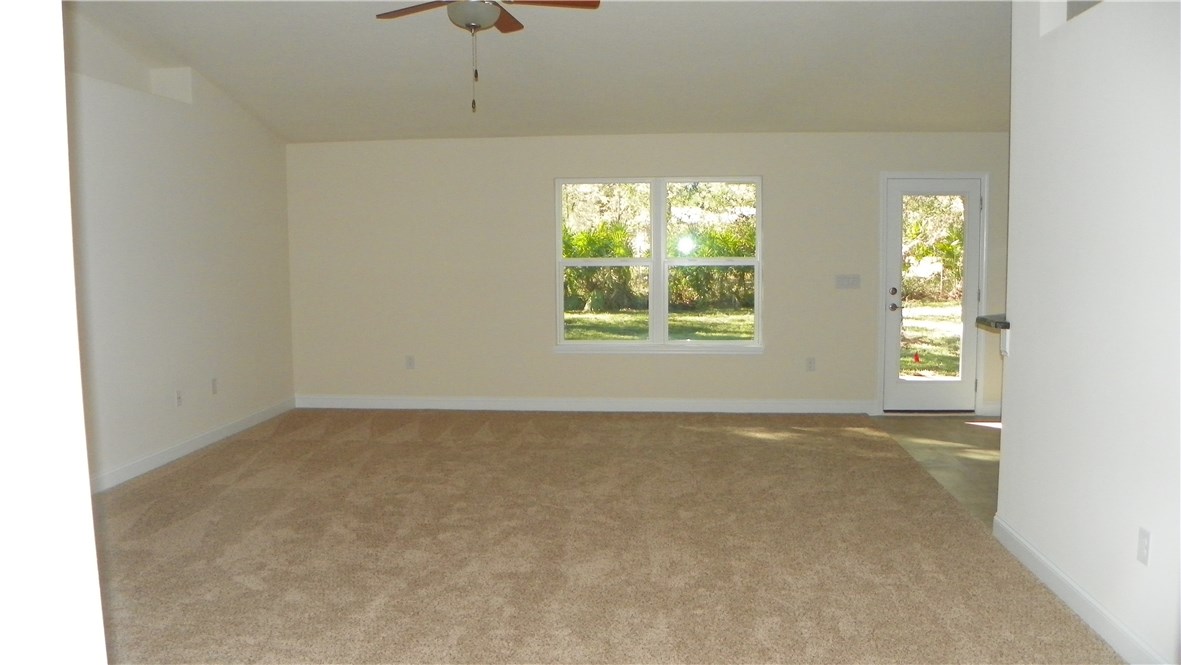 88100 Maybourne Road Yulee, FL 32097 - Photo 5 of 8 an empty room with windows