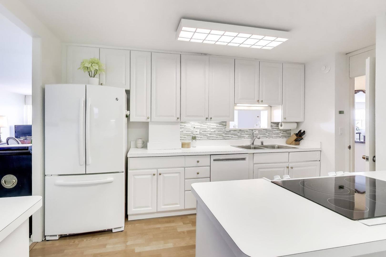 1630 Sheridan Road, Unit 7K Wilmette, IL 60091 - Photo 16 of 28 a kitchen with a refrigerator a sink and cabinets
