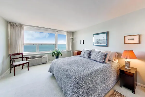 a bedroom with a bed and a couch