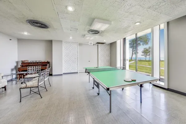 a room with furniture and pool table