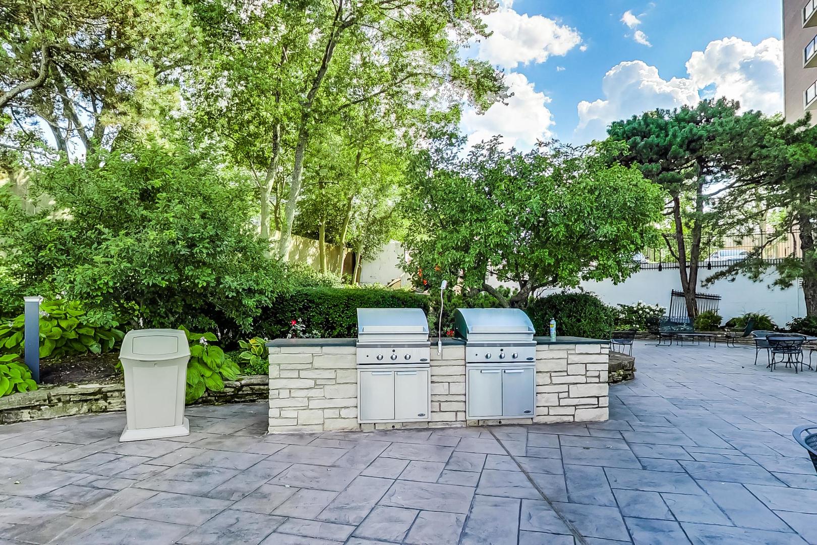 1630 Sheridan Road, Unit 7K Wilmette, IL 60091 - Photo 28 of 28 a view of a chairs and table in a yard