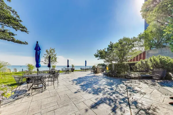 a view of a backyard with sitting area