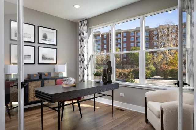 a workspace with furniture and a window