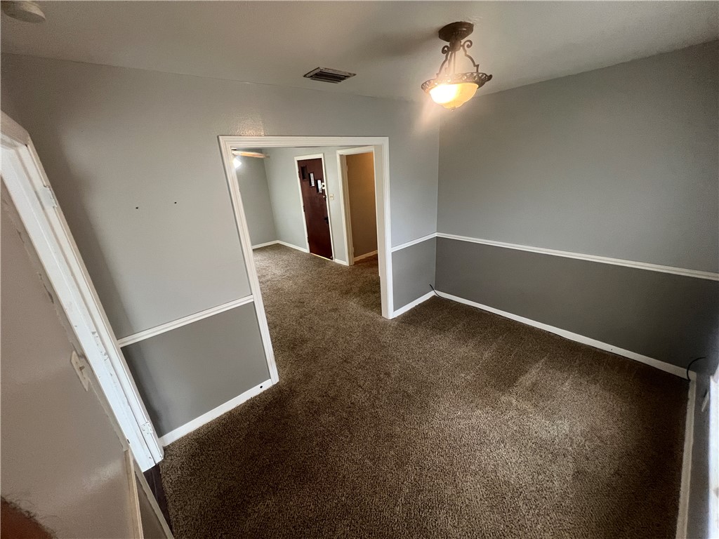 701 Anderson Street Corpus Christi, TX 78411 - Photo 3 of 10 wooden floor in an empty room with a window