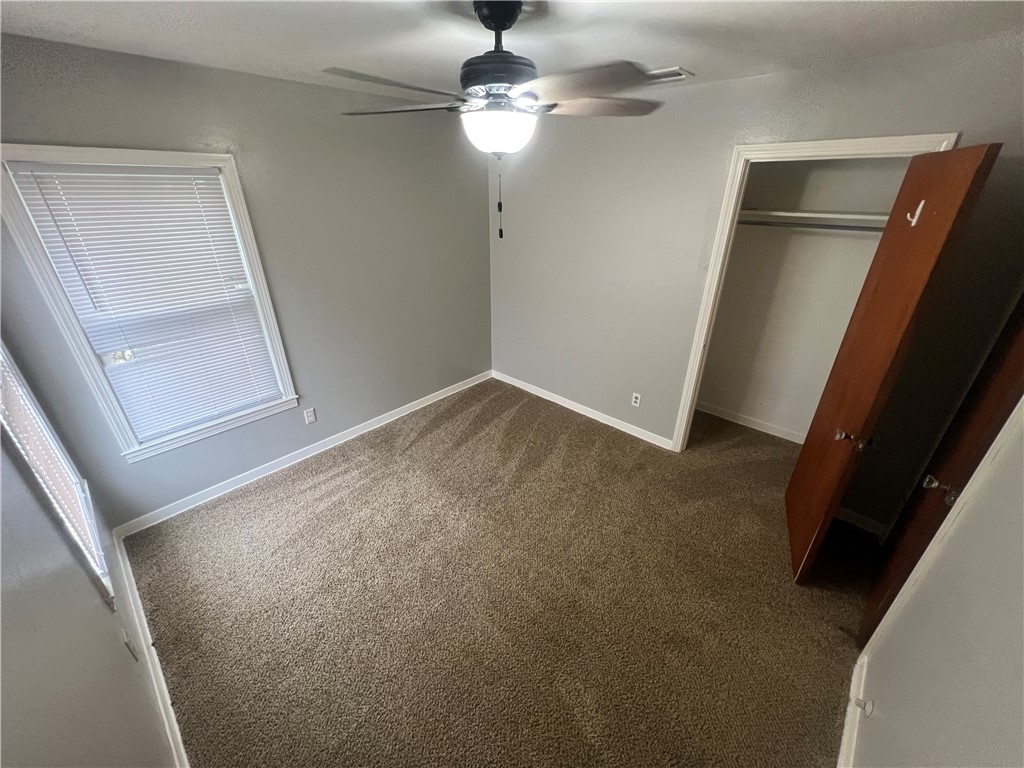 701 Anderson Street Corpus Christi, TX 78411 - Photo 8 of 10 a view of a livingroom with a ceiling fan and window
