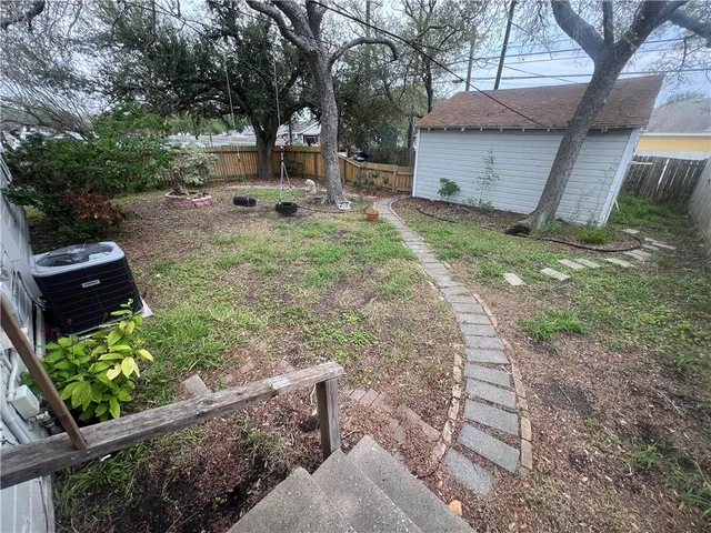 a view of backyard of house