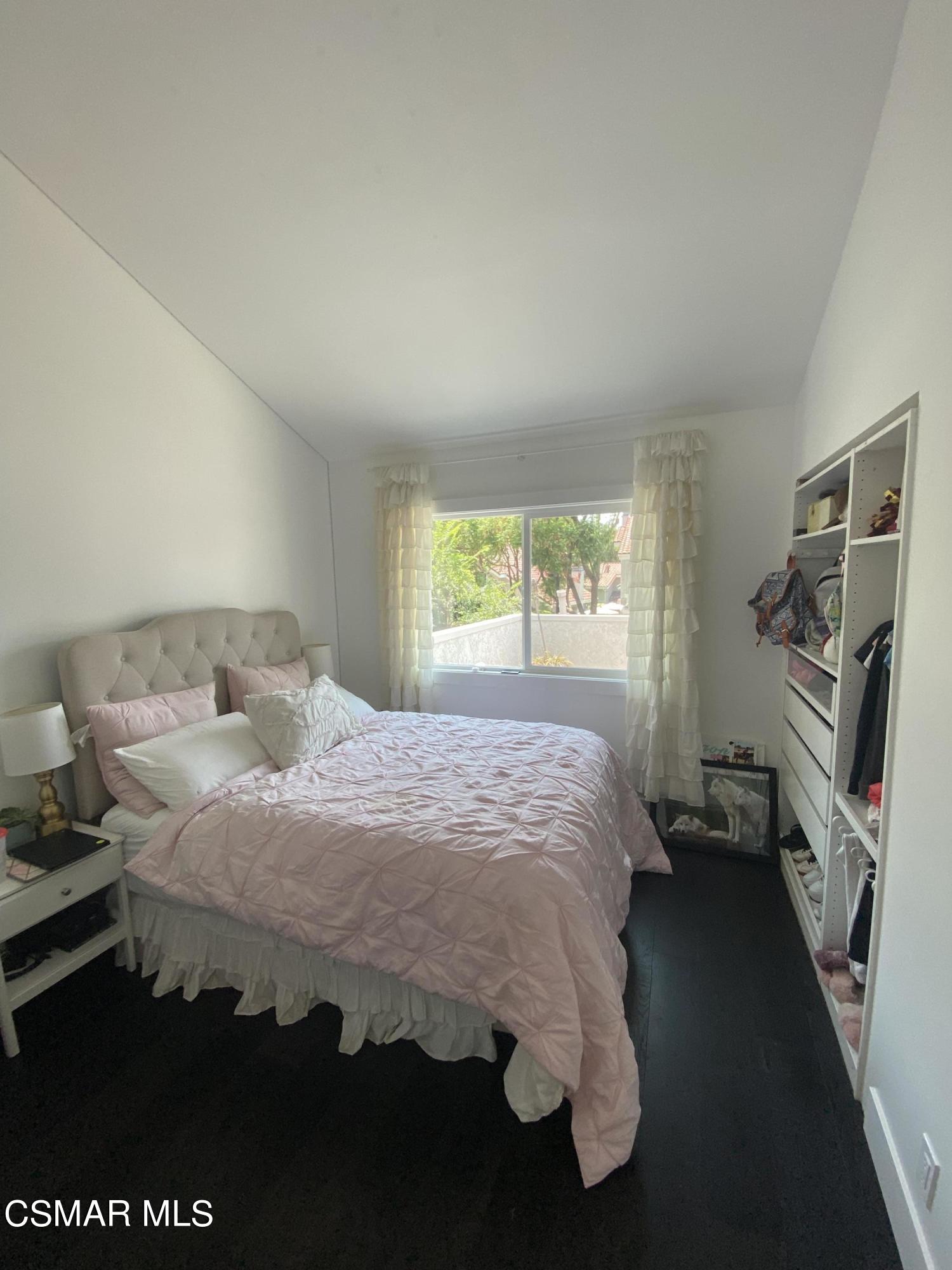 979 Thistlegate Road Oak Park, CA 91377 - Photo 17 of 19 a bedroom with a bed and a window