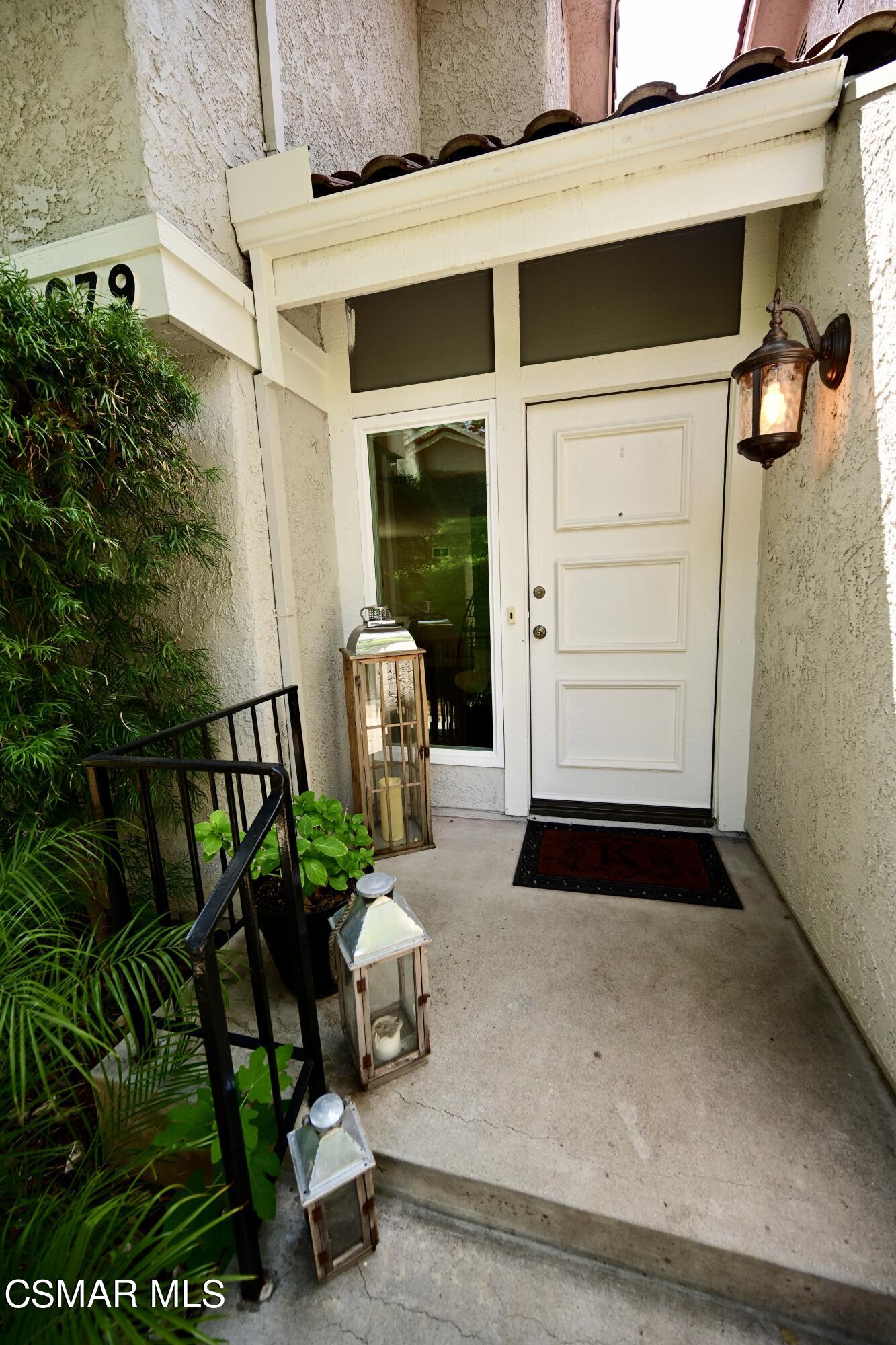979 Thistlegate Road Oak Park, CA 91377 - Photo 18 of 19 a front view of a house with a yard