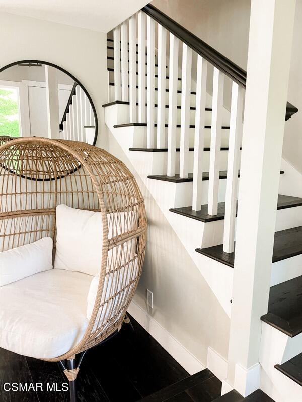 979 Thistlegate Road Oak Park, CA 91377 - Photo 7 of 19 a bedroom with a bed and a black white checkered floor