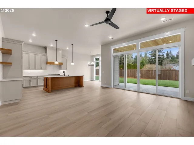 a view of kitchen with furniture and wooden floor