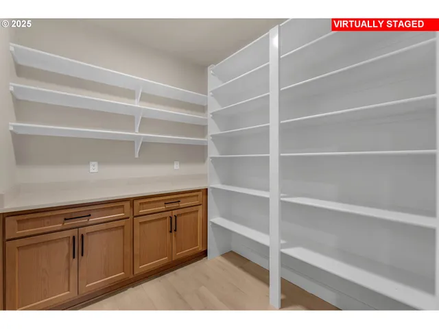 a view of a room with cabinets and window