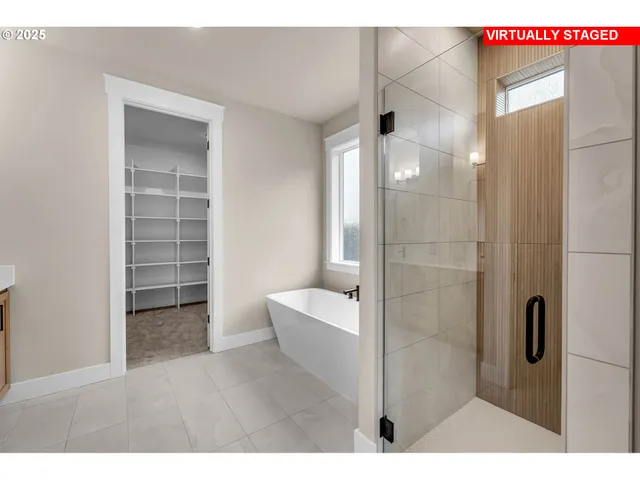 a bathroom with a bathtub and a shower