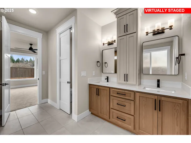 a bathroom with a double vanity sink and mirror