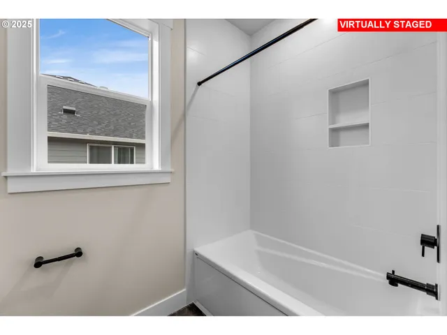 a bathroom with a shower and a sink