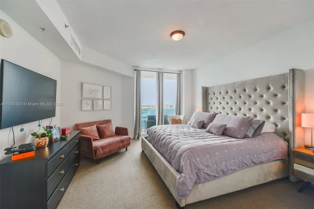 a bathroom with a double vanity sink mirror and shower